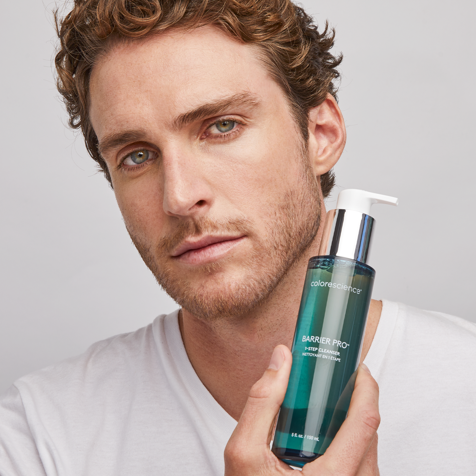 man holding Barrier Pro™ 1-Step Cleanser || all